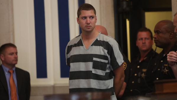 Ray Tensing, a former UC officer, enters the courtroom for his arraignment on a murder charge Thursday.