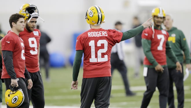 Green Bay Packers quarterback Aaron Rodgers (12) talks to quarterback Joe Callahan (6) and quarterback Jerod Evans (9) during practice at the Don Hutson Center on Wednesday, December 6, 2017 in Ashwaubenon, Wis.