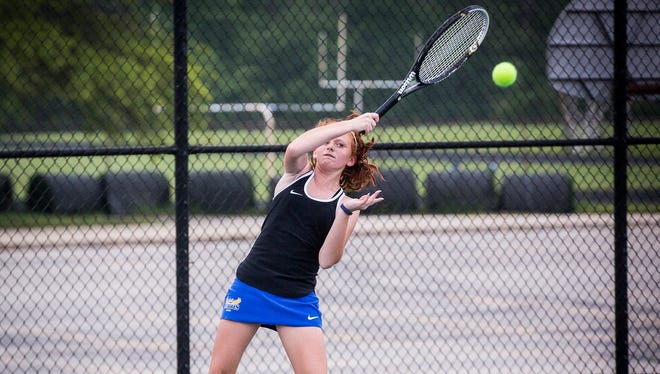 No. 1 singles player isabelle Behrman swings during her sectional match against Delta at Delta High School Friday, May 19, 2017.