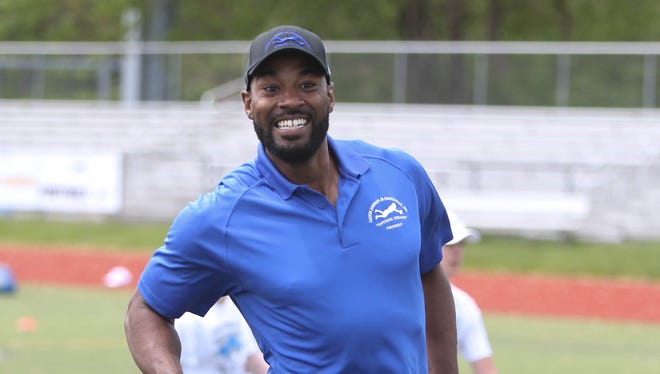 Former Detroit Lions receiver Calvin Johnson encourages young players during the Calvin Johnson Jr. Foundation Catch a Dream football camp held at Southfield high school Saturday, May 20, 2017 in Southfield.