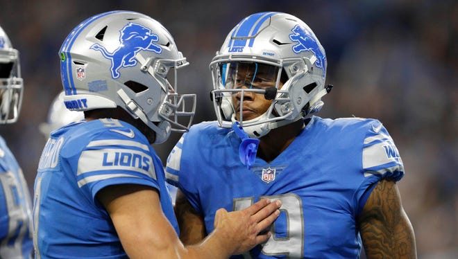 Lions receiver Kenny Golladay, right, celebrates with quarterback Matthew Stafford after combining for a touchdown in the fourth quarter against the Cardinals at Ford Field on Sept. 10, 2017.