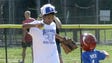 The White team first baseman beats a blue team runner