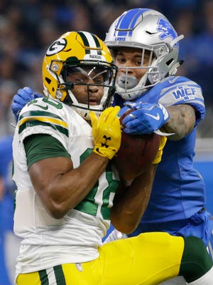 Lions cornerback Teez Tabor hits Packers receiver Randall Cobb to force an incomplete pass during the first quarter Dec. 31, 2017.