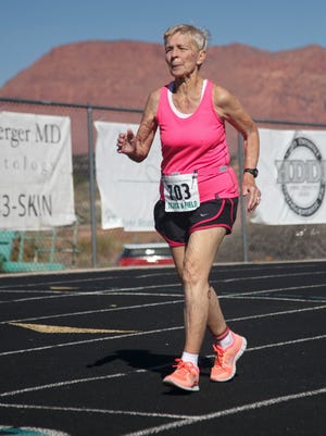 Dottie Gray runs on the track at Snow Canyon High School during Huntsman World Senior Games competition Wednesday, Oct. 7, 2015.