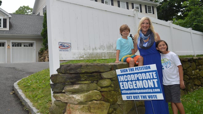 Aubrey Graf-Daniels, with her sons, Alexander, right, and Nicholas by their home in Edgemont.