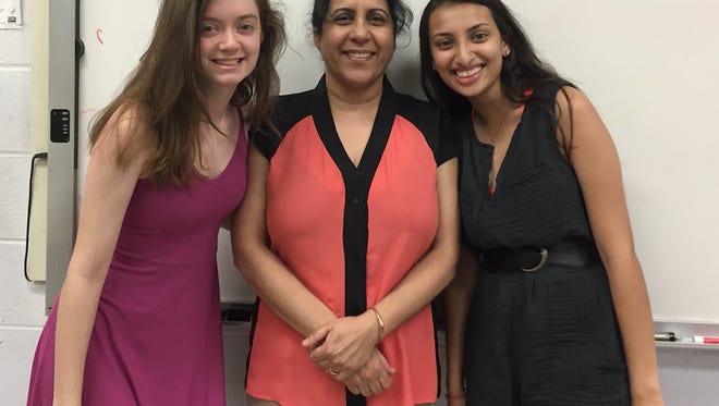 Myriam Burger, left, and Aastha Jain with their adviser, Ravinder Bajwa.