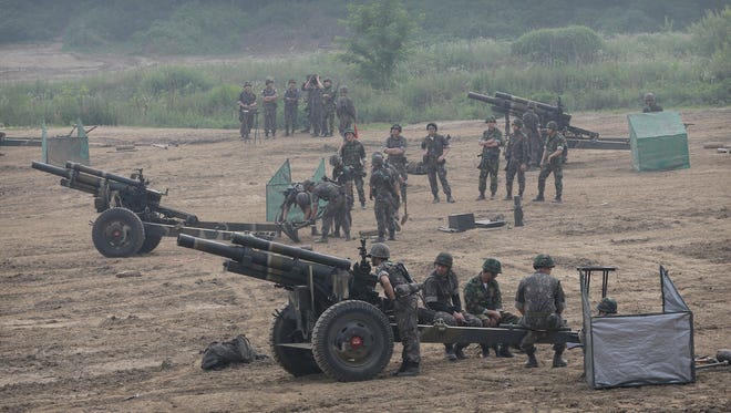 South Korean army soldiers prepare to fire 105mm howitzers during an exercise in Paju, South Korea, near the border with North Korea Wednesday, June 22, 2016. In a remarkable show of persistence, North Korea on Wednesday fired two suspected powerful new Musudan mid-range missiles, U.S. and South Korean military officials said, but at least one of the launches apparently failed, Pyongyang's fifth such reported flop since April.