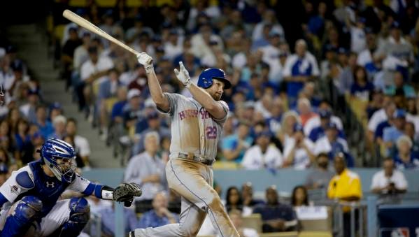 New York Mets' Daniel Murphy watches his solo home run during the sixth inning in Game 5 of baseball's National League Division Series against the Los Angeles Dodgers Thursday, Oct. 15, 2015, in Los Angeles.