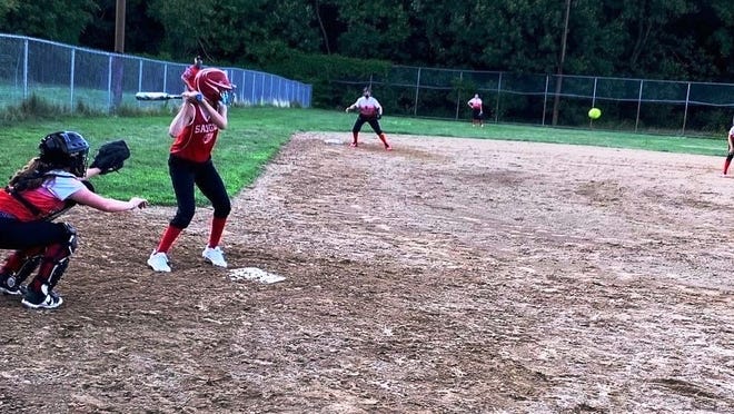 Olivia Arsenault of the Saugus Girls Softball U-14 team takes her turn at the plate, preparing to swing away during a recent game.