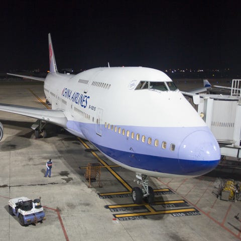 A China Airlines Boeing 747 pulls into a gate at...