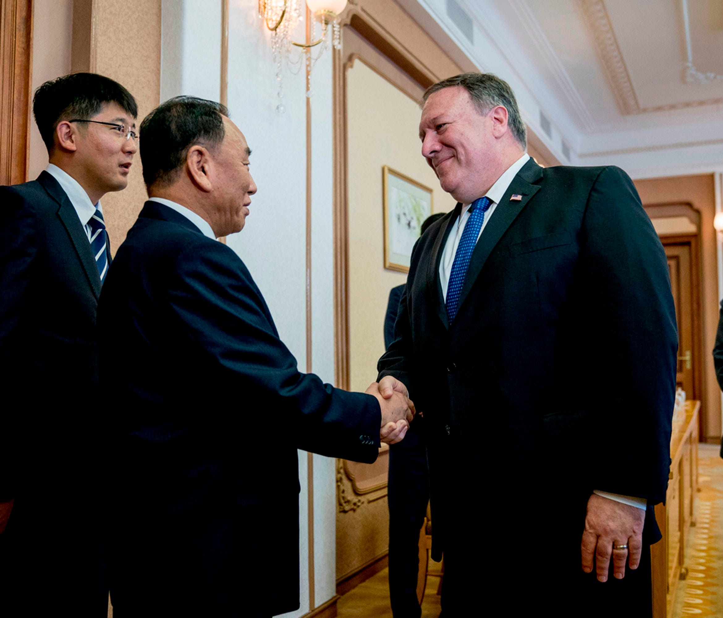 Secretary of State Mike Pompeo greets North Korea's director of the United Front Department, Kim Yong Chol as they arrive for a meeting at the Park Hwa Guest House in Pyongyang on July 6, 2018.