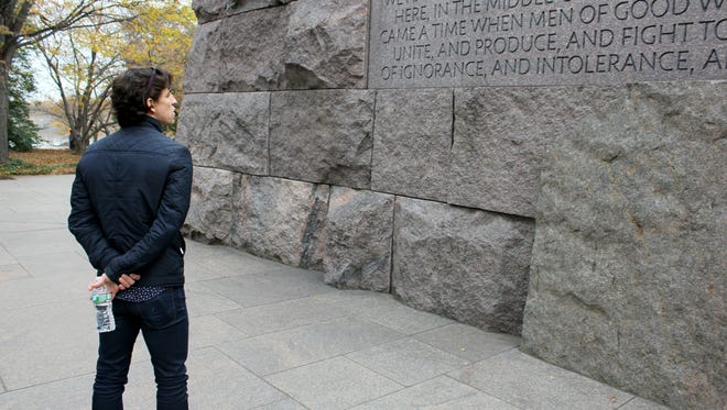 Cincinnati Ballet Principal Dancer Cervilio Miguel Amador, viewing a particularly moving quotation inscribed on the walls of the Franklin Delano Roosevelt Memorial in Washington, D.C. Amador visited the memorial as part of a Thanksgiving Day tour and dinner for Cincinnati Ballet dancers and their supporters.