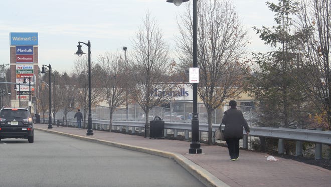Pedestrians walking to the Passaic Street shopping complex on Dec. 5.