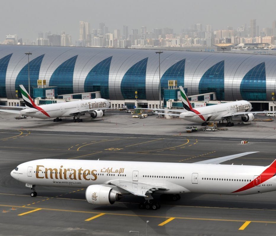 Emirates planes are seen at Dubai International Airport on March 22, 2017.