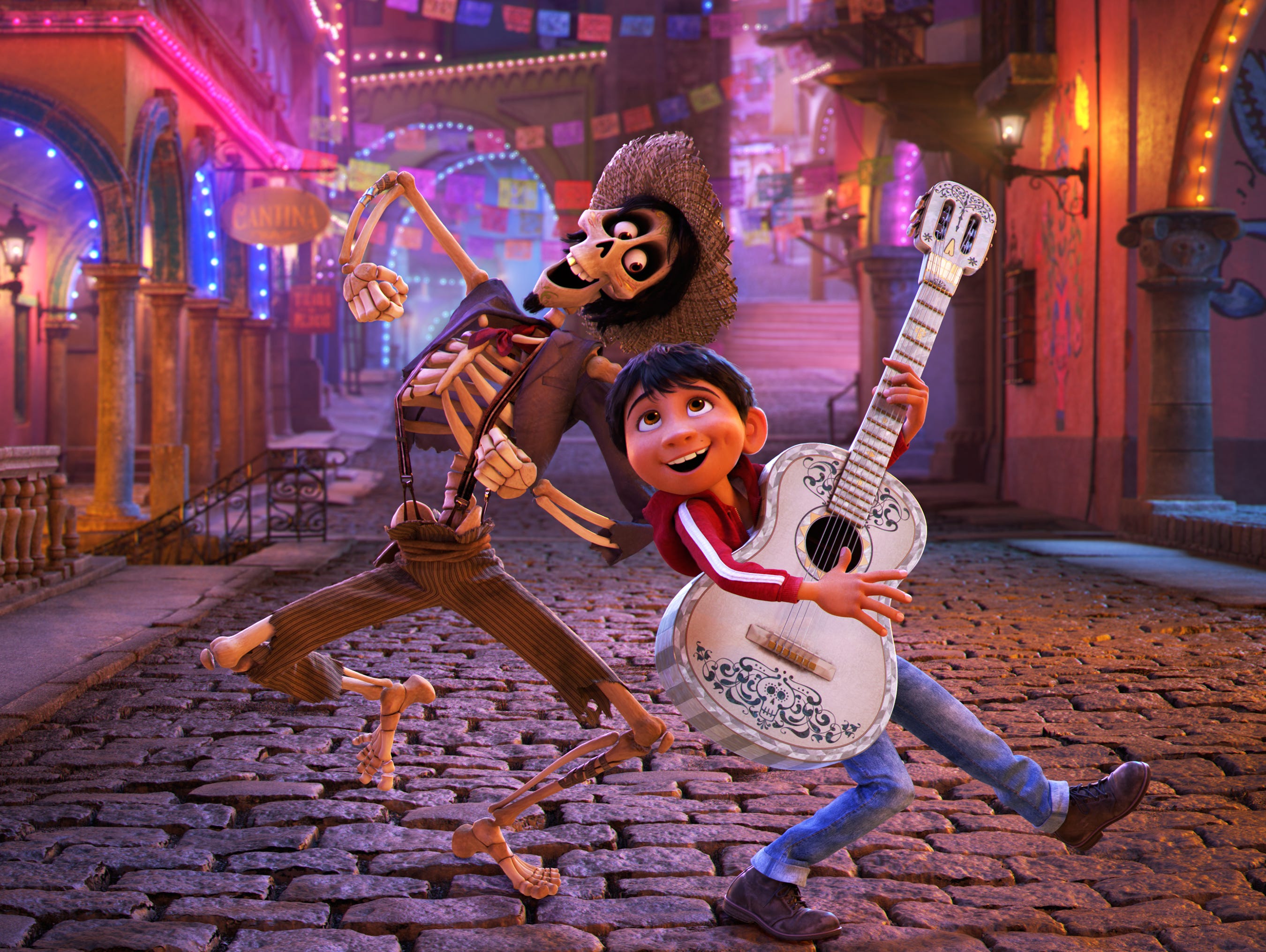 Hector (left, voiced by Gael Garcia Bernal) and Miguel (Anthony Gonzalez) are traveling buddies in Pixar's animated 'Coco.'