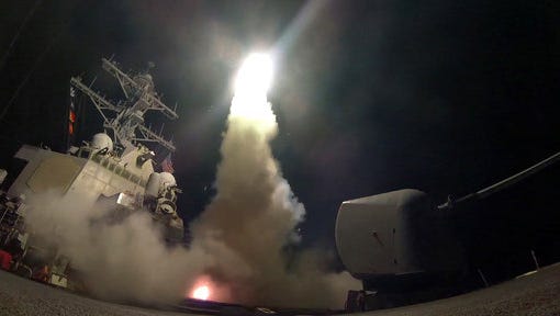 In this image provided by the U.S. Navy, the guided-missile destroyer USS Porter (DDG 78) launches a tomahawk land attack missile in the Mediterranean Sea, Friday, April 7, 2017.  President Donald Trump’s decision to launch missiles at Syria government risked rising tensions with Iran, a key backer of Syrian President Bashar Assad in a conflict with dangerously blurry battle lines.