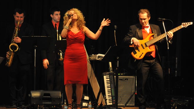 The band Groove Essential plays during the 2013 Red Dress Ball in the Kuhlman Center on the Wayne County Fairgrounds in Richmond.