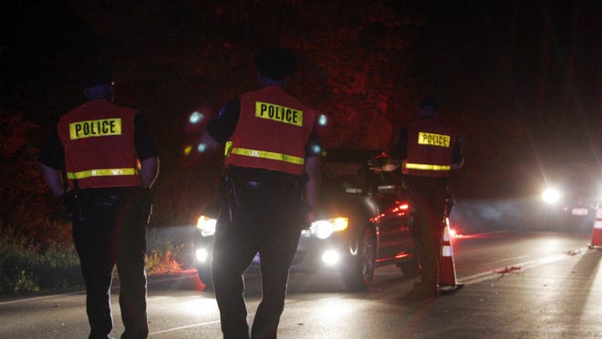 North Castle police conduct a DWI checkpoint on Route 128 near Wampus Pond in Armonk.