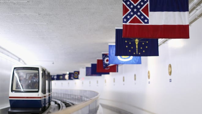 Mississippi's state flag, top right, is displayed with the flags of the other 49 states and territories in a tunnel connecting Senate office buildings and the U.S. Capitol.