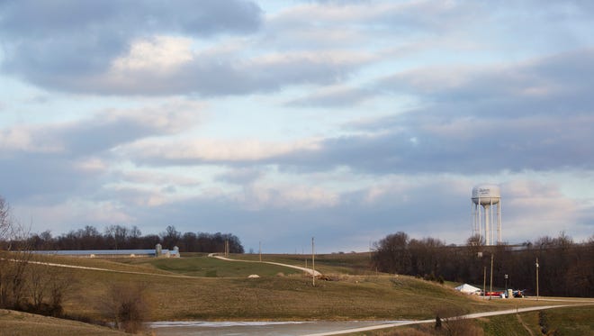 A work station can be seen set up at the entrance to a commercial turkey farm in Dubois, Ind. on Monday, Jan. 18, 2016. National, state and local officials are continuing work on containment and depopulation for the avian flu outbreak that was discovered late last week at 10 farms near the rural Indiana community. Animal health officials investigating a bird flu strain that affected 10 turkey farms in southwestern Indiana have added 156,000 chickens to the list of thousands of birds being euthanized. (Alisha Jucevic/The Herald via AP)