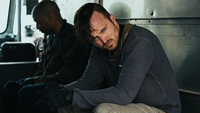 Chiwetel Ejiofor and Aaron Paul are part of a gang of thieves in "Triple 9."