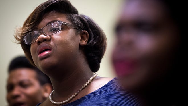 Brianna Barbour sings during rehearsal with the Fisk Jubilee singers at Fisk University, Tuesday, Feb. 23, 2016, in Nashville, Tenn. Complications from Barbour's cancer treatments resulted in her having to relearn how to sing.