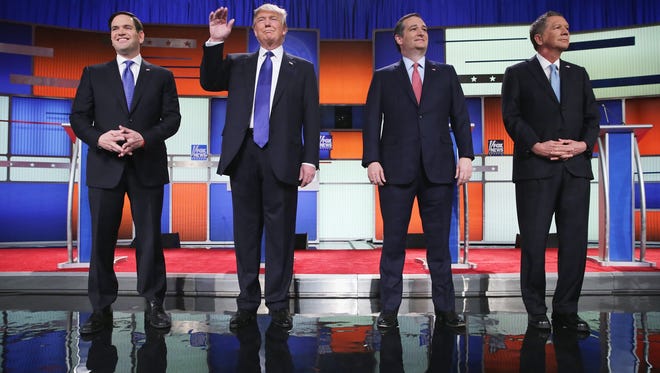 Republican presidential candidates (from left) Sen. Marco Rubio, Donald Trump, Sen. Ted Cruz and Ohio Gov. John Kasich participate in a debate sponsored by Fox News on Thursday in Detroit.