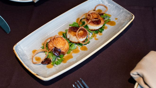 Pan Seared U-15 Diver Scallops with herb salad, crispy chorizo, fried shallots, finished with chorizo vinaigrette at La Chasse on Bardstown Road