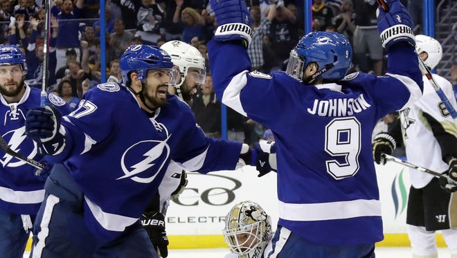 Tyler Johnson (9) of the Tampa Bay Lightning celebrates with his teammates Alex Killorn (17) after scoring a goal against Matt Murray (30) of the Pittsburgh Penguins during the second period in Game 4 of the Eastern Conference finals. Tampa Bay won 4-3 Friday to even the best-of-seven series 2-2.