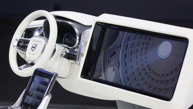 A large monitor opens from a dashboard as Volvo Concept 26 autonomous vehicle technology is presented at the 2015 Los Angeles Auto Show on November 18, 2015 in Los Angeles, California.