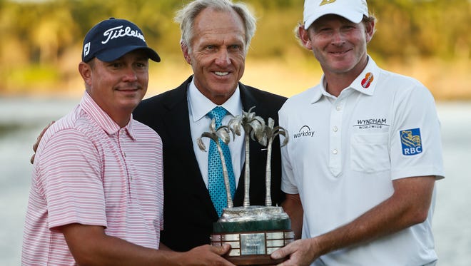 Brandt Snedeker, right, Greg Norman, and Jason Dufner pose along with the Franklin Templeton Shootout trophy after winning at Tiburon Golf Club in Naples on Saturday, Dec. 12, 2015.