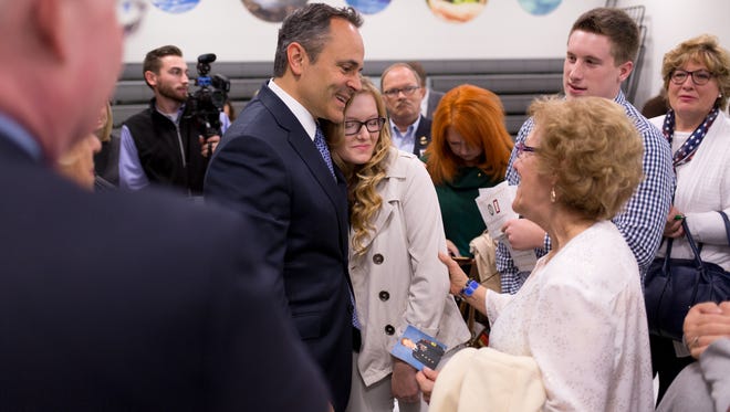 Kentucky Governor Matt Bevin, left, hugs Brianna Cornett of London after meeting with her and Karen McMullen. The family lost Sgt. 1st Class Lance Cornett a Delta Force soldier killed in Iraq back in 2006. A ceremony was held in memory of fallen soldiers while unveiling plaques with the re-named Jane Beshear Capitol Education Center to now honoring the building for Gold Star Families, Monday, Nov. 21, 2016 at the Capitol Education Building in Frankfort. 