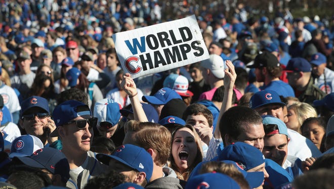 CHICAGO, IL - NOVEMBER 04:  Chicago Cubs fans attend a rally in Grant Park to celebrate the team's World Series victory on November 4, 2016 in Chicago, Illinois. Hundreds of thousand of people lined the streets in downtown Chicago as the team paraded by in double deck buses on the way to the rally.  (Photo by Scott Olson/Getty Images)