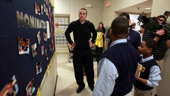 Memphis Grizzlies owner Robert Pera visits with students and staff at Grizzlies Prep on Feb. 12, 2013.