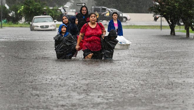 Volunteers and First Responders help flood victims evacuate to shelters in Houston, TX. Monday, Aug. 28, 2017.