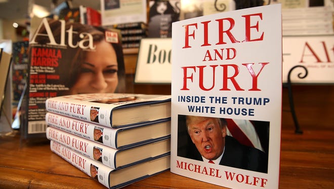Copies of the book "Fire and Fury" by author Michael Wolff are displayed on a shelf at Book Passage on January 5, 2018 in Corte Madera, California. A controversial new book about the inner workings of the Trump administration hit bookstore shelves nearly a week earlier than anticipated after lawyers for Donald Trump issued a cease and desist letter to publisher Henry Holt & Co.