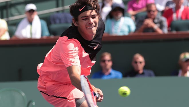 Taylor Fritz returns to Borna Coric at the BNP Paribas Open, Wednesday, March 14, 2018.