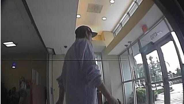 Surveillance image from an armed robbery at a North Naples bank Thursday afternoon.
