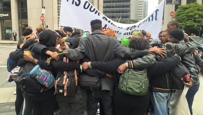A group of protesters rallying behind the "Black Lives Matter" slogan in downtown San Francisco Thursday May 21. 2015.