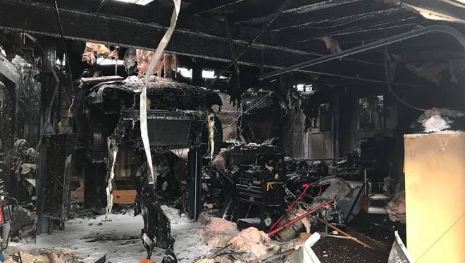 The interior of Hiram Auto Repair on John Street is visible after a structure fire Saturday morning destroyed the contents of the building.