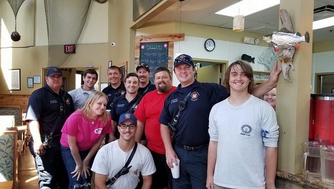 Local residents Tommy Harden and Lawren Jones organized a hot meal at TIn Fish for Okeechobee's first responders and FPL linemen.