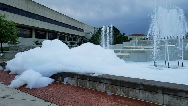 Soapy bubbles fill the main fountain on the Missouri State University campus.