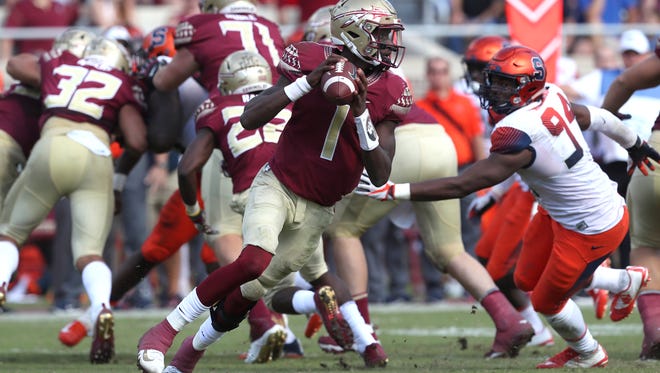 FSU’s James Blackman scrambles out of the pocket against Syracuse during their game at Doak Campbell Stadium on Saturday, Nov. 4, 2017.