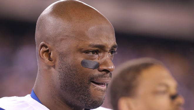 Colts WR Reggie Wayne has a tear in his eye as he listens to the national anthem before the game with the Giants, Nov. 3, 2014.