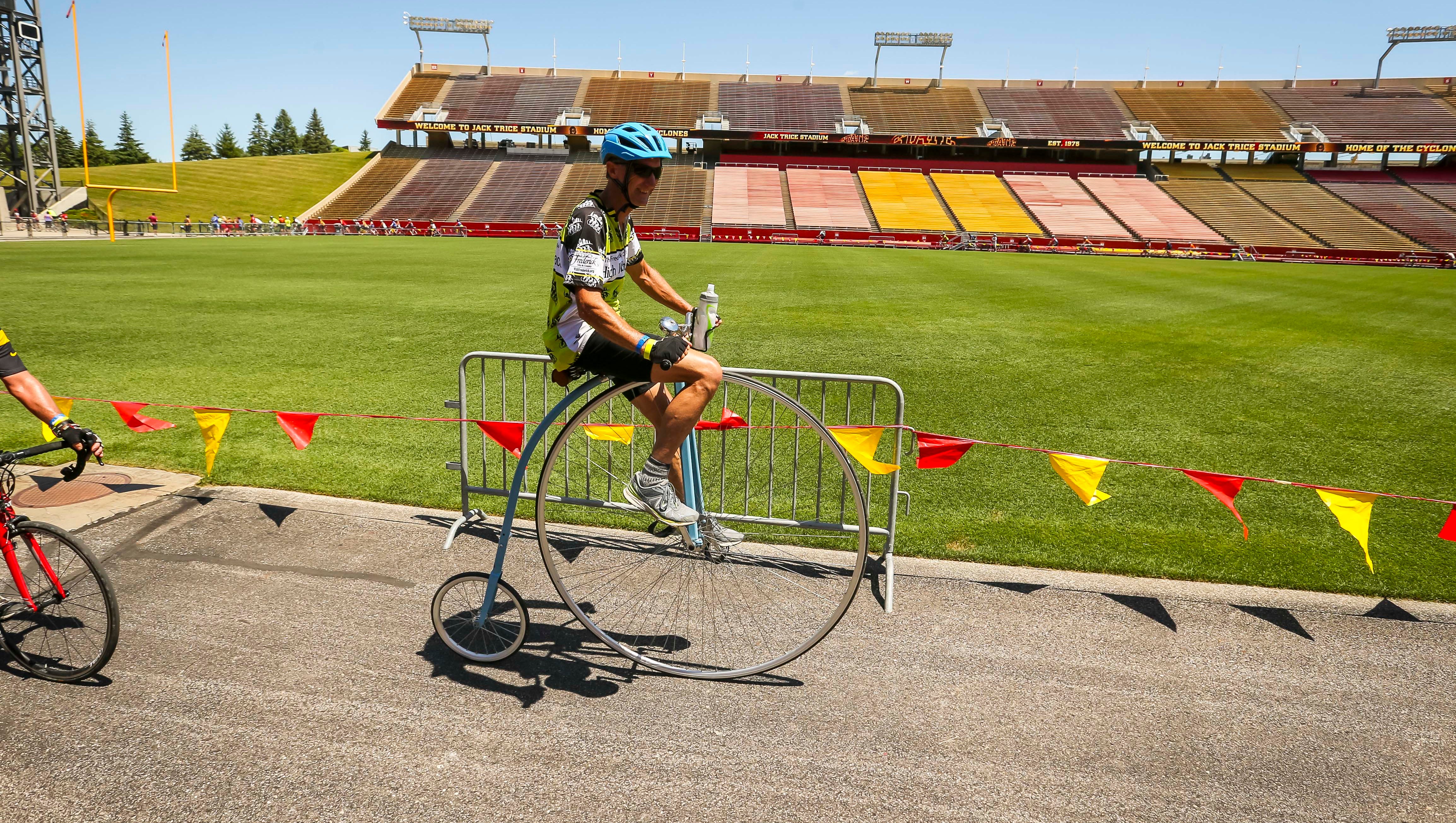A rider makes a lap at Iowa State University's Jack Trice Stadium during RAGBRAI 2018.
