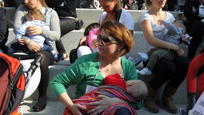 Mothers breastfeed their babies during a 2013 celebration of World Breastfeeding Week, in Thessaloniki, Greece.