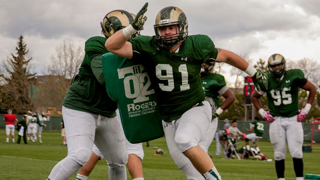 CSU defensive lineman Jakob Buys blows by a blocker in practice Tuesday. Buys is hoping to earn a starting spot on a defensive line that lost every one of last year's starters to graduation.