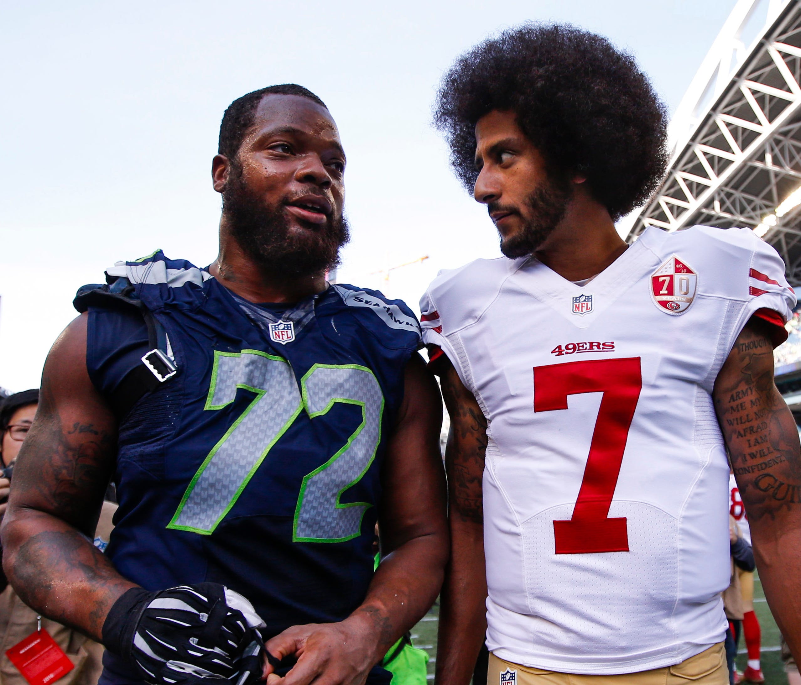 Former 49ers QB Colin Kaepernick (7) and Seahawks DE Michael Bennett used to be NFC West rivals.