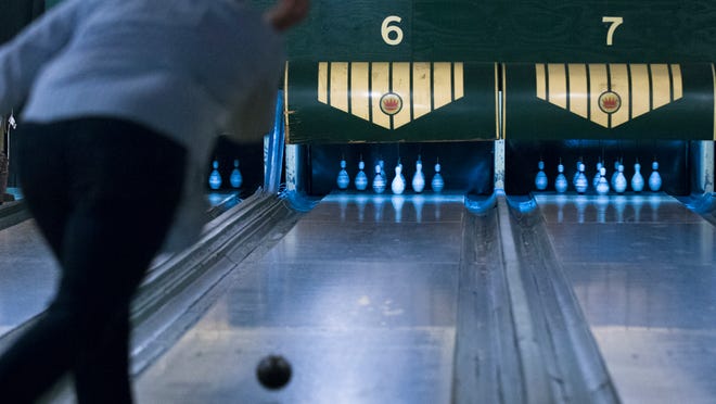 Action Duckpin in Indianapolis, Indiana. Duckpin bowling uses a ball about the size of a grapefruit with no finger holes to knock down shorter, smaller and lighter pins.