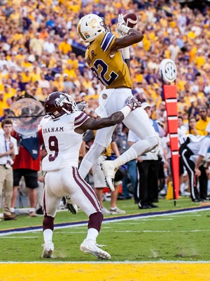 LSU Tigers wide receiver D.J. Chark (82) with the near catch during the first half of a SEC game between Mississippi State and the LSU Tigers in Death Valley on Saturday Sept. 17, 2016.